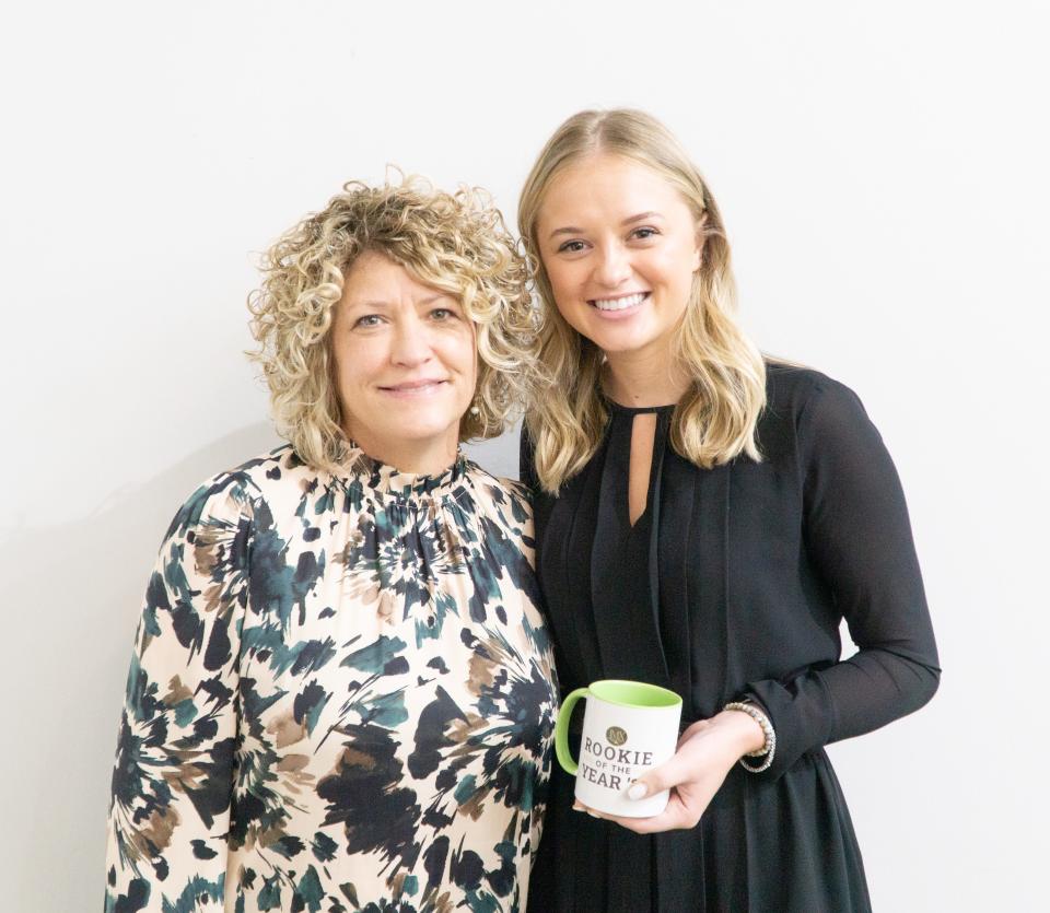 Rookie of the Year Julianna Young, right, with Linse Miller, vice president of DutchCrafters.