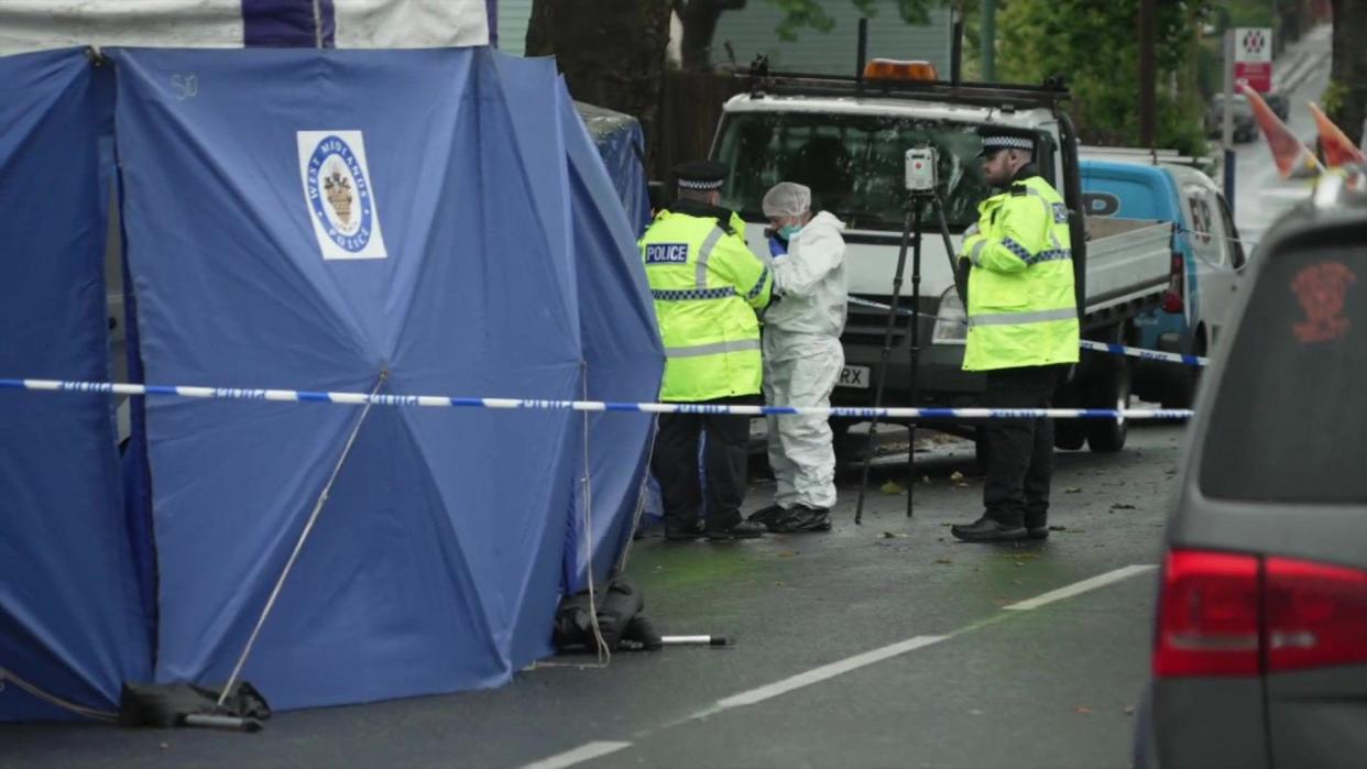 Blue tent and police at the scene