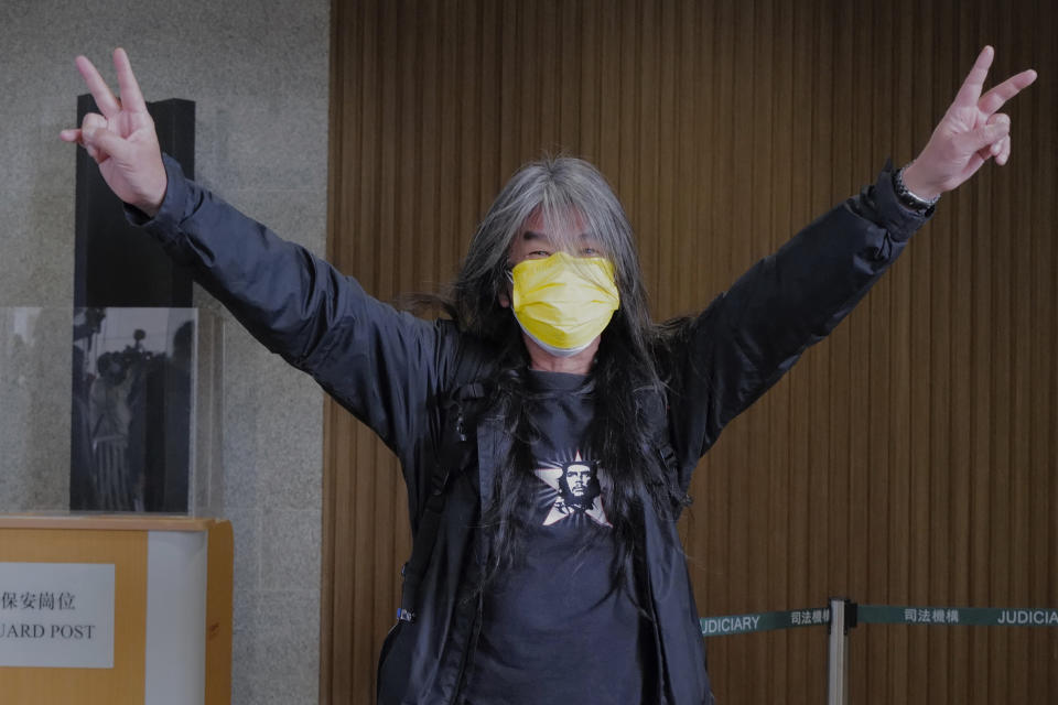 Hong Kong pro-democracy activists Leung Kwok-hung gestures as he arrives at a court in Hong Kong Tuesday, Feb. 16, 2021. Leung is among nine prominent Hong Kong's democracy advocates facing trial Tuesday on charges of organizing an unauthorized assembly in August 2019.(AP Photo/Vincent Yu)