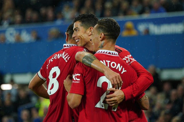 Manchester United’s Cristiano Ronaldo (centre) celebrates scoring the 700th goal of his club career against Everton