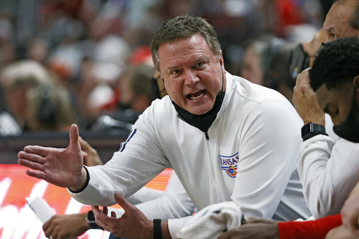 Kansas coach Bill Self talks to his team on the bench during the first half of an NCAA college basketball game against Texas Tech, Saturday, Jan. 8, 2022, in Lubbock, Texas. (AP Photo/Brad Tollefson)