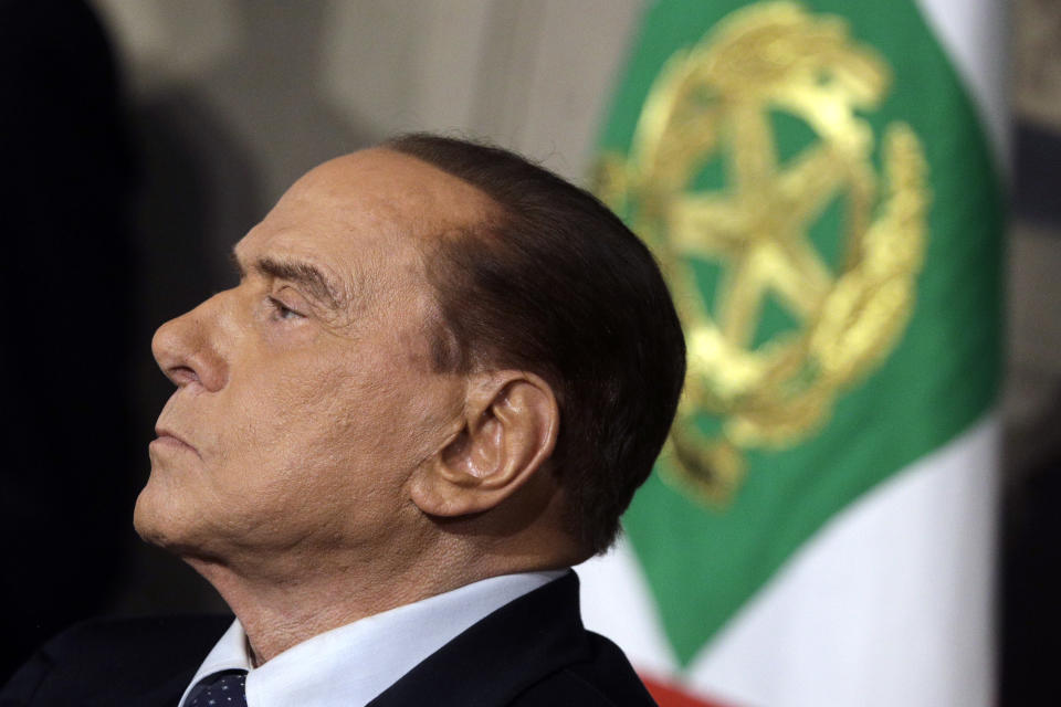 FILE - Silvio Berlusconi meets journalists at the Quirinale presidential palace after talks with Italian President Sergio Mattarella, in Rome, April 12, 2018. Silvio Berlusconi, the boastful billionaire media mogul who was Italy's longest-serving premier despite scandals over his sex-fueled parties and allegations of corruption, died, according to Italian media. He was 86. (AP Photo/Gregorio Borgia, File)