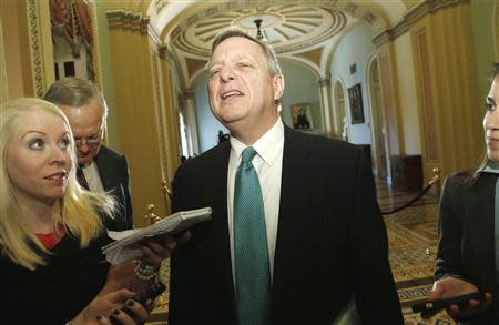 U.S. Senator Dick Durbin (D-IL) (C) talks to reporters at the U.S. Capitol in Washington, January 7, 2014. REUTERS/Jonathan Ernst