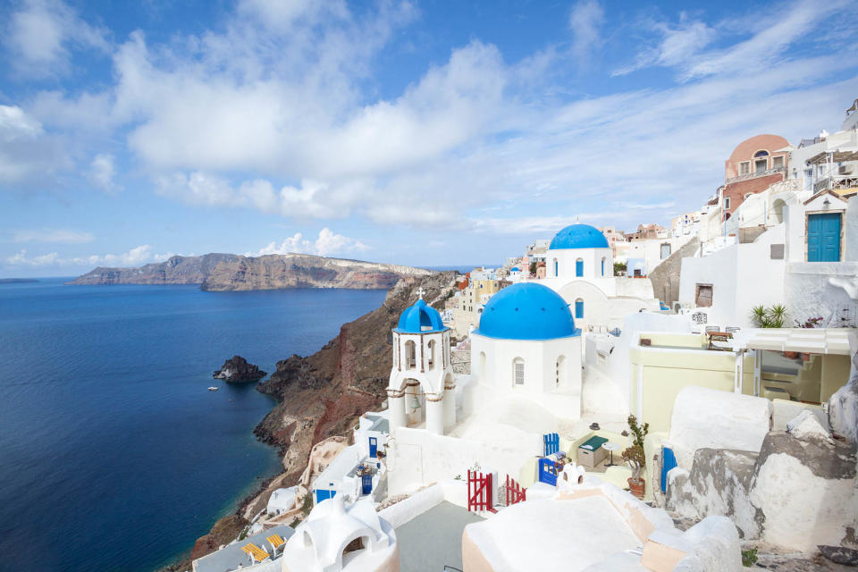 Iconic blue domed churches in Oia Santorini Greece (Matteo Colombo / Getty Images)