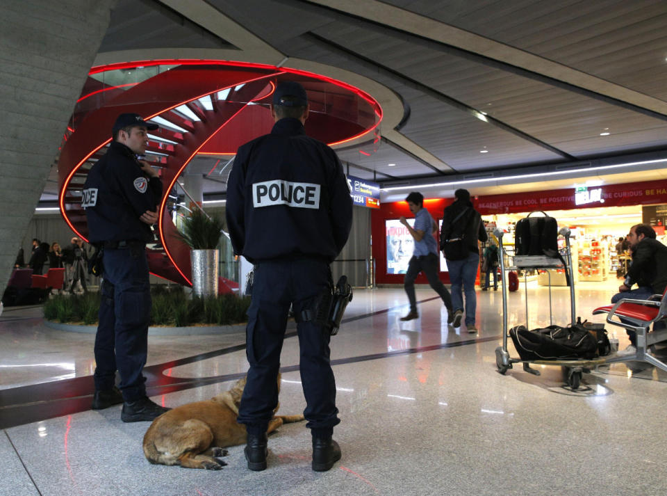 Police officers patrol at Charles de Gaulle airport, outside of Paris. (AP Photo/Christophe Ena)
