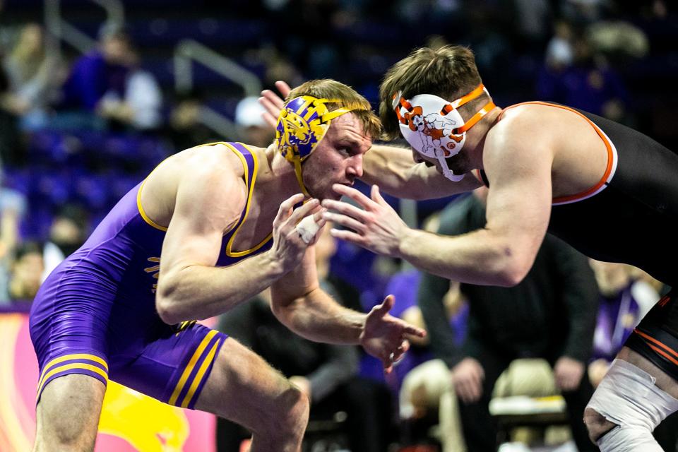 Northern Iowa's Derek Holschlag, left, wrestles Oklahoma State's Kaden Gfeller at 157 pounds during a NCAA Big 12 Conference men's wrestling dual earlier this season.