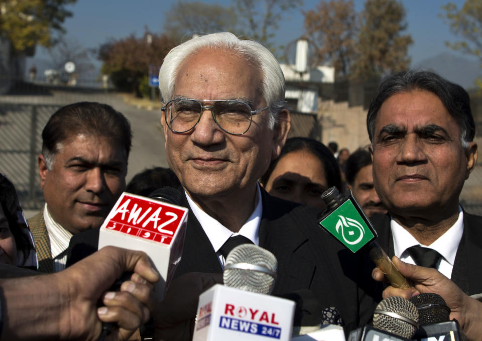 Ahmed Raza Qasuri, attorney of Pakistan's former president and military ruler Pervez Musharraf briefs the media about Musharraf's condition to media, outside a court in Islamabad, Pakistan, Thursday, Jan. 2, 2014. Musharraf was rushed to the hospital Thursday with a “heart problem” while he was on his way to court for a hearing in his high treason case, said police and his lawyers. (AP Photo/B.K. Bangash)