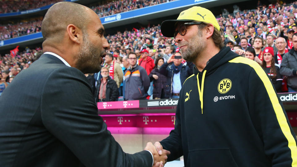 Klopp y Guardiola se saludan.