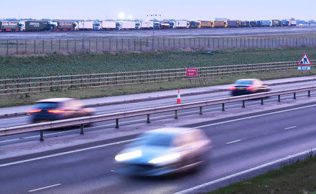 Lorries are seen queue at the Manston Airport waiting to do a test drive to the Port of Dover during a trial of how road will cope in case of a "no-deal" Brexit, Kent, Britain January 7, 2019. REUTERS/Toby Melville