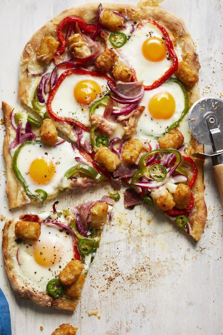 <p>This breakfast pizza is guaranteed to have your guests reaching for seconds — and thirds!</p><p><strong><em><a href="https://www.womansday.com/food-recipes/food-drinks/a16758628/tater-tot-pizza-recipe/" rel="nofollow noopener" target="_blank" data-ylk="slk:Get the Tater Tot Pizza recipe.;elm:context_link;itc:0;sec:content-canvas" class="link ">Get the Tater Tot Pizza recipe.</a></em></strong> </p>