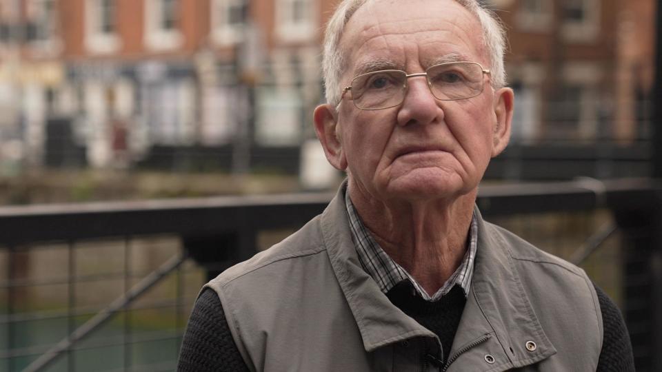 Tony Martin, a voter from Hull, stands on a street