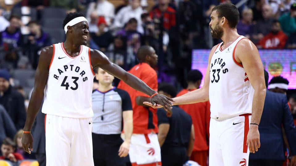 TORONTO, ON - DECEMBER 01:  Pascal Siakam #43 of the Toronto Raptors slaps hands with Marc Gasol #33 during the first half of an NBA game against the Utah Jazz at Scotiabank Arena on December 01, 2019 in Toronto, Canada.  NOTE TO USER: User expressly acknowledges and agrees that, by downloading and or using this photograph, User is consenting to the terms and conditions of the Getty Images License Agreement.  (Photo by Vaughn Ridley/Getty Images)