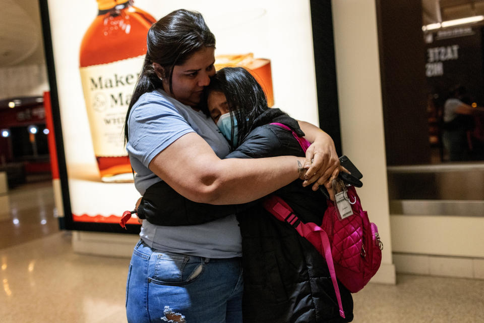 Honduran immigrant Nani, 10, is greeted by her aunt Saiyda Gonzalez upon her flight's arrival on April 23, 2021 to Louisville, Kentucky. The unaccompanied minor had been released that day from U.S. Health and Human Services custody after spending nearly eight weeks in shelter. / Credit: / Getty Images