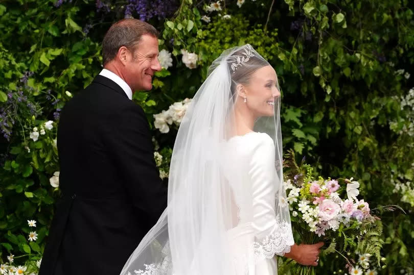 Olivia Henson, with her father Rupert Henson, arrives for her wedding to Hugh Grosvenor, the Duke of Westminster at Chester Cathedral -Credit:Peter Byrne/PA Wire