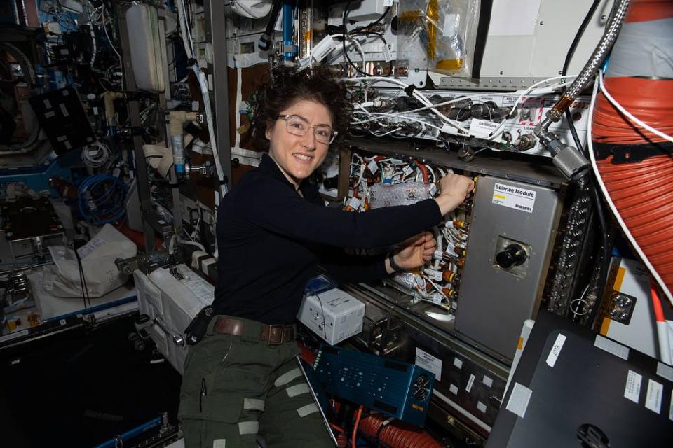 Christina Koch working on cold atom lab