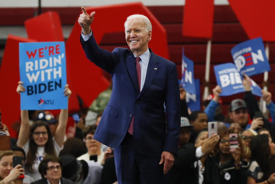 FILE - In this March 9, 2020, file photo Democratic presidential candidate former Vice President Joe Biden speaks during a campaign rally at Renaissance High School in Detroit. White House contenders aren't typically bashful about asking for money. But as the coronavirus pandemic upends life, President Donald Trump and his likely Democratic rival, Biden, suddenly find themselves navigating perilous terrain. (AP Photo/Paul Sancya, File)