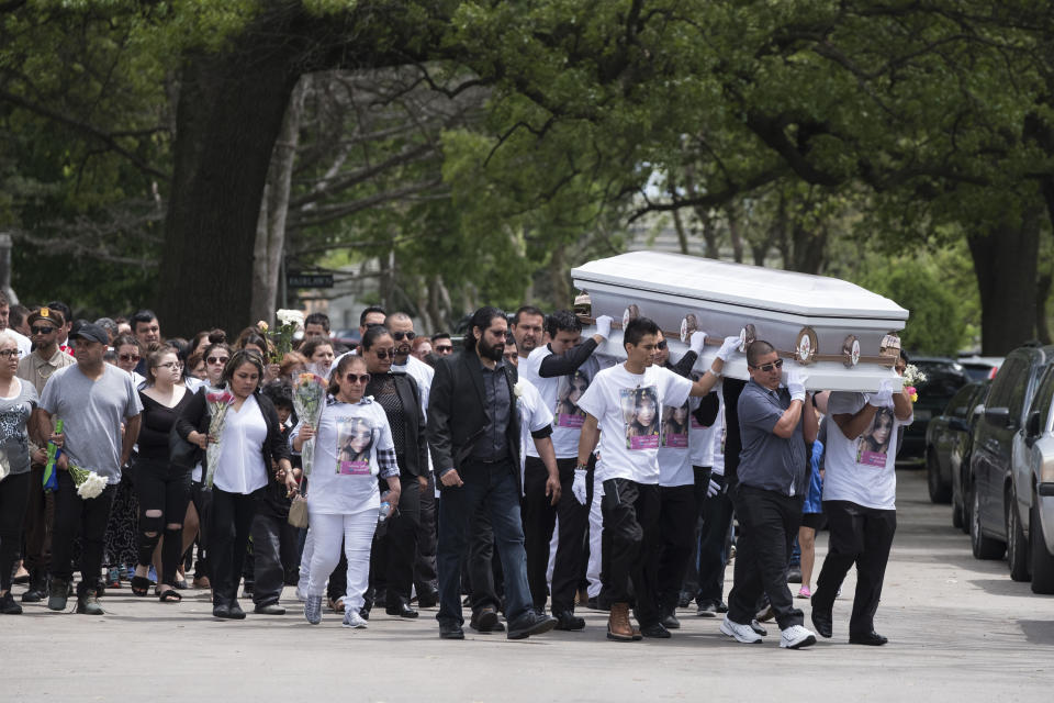 Mourners carry a casket at the funeral of Marlen Ochoa-Lopez at Mount Auburn Funeral Home in Chicago.