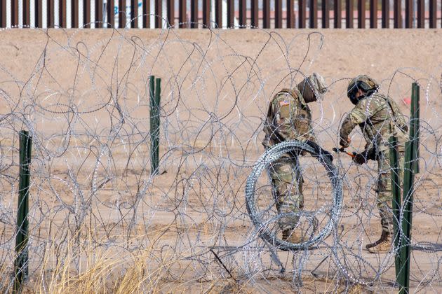 U.S. Border Patrol officers cut through razor wire near Ciudad Juarez, Mexico, on Jan. 31. 