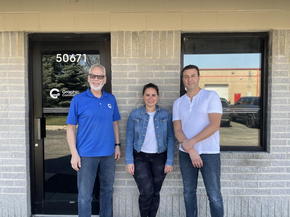 Dennis Wrobleski (left) has sold his 43-year printing business Graphic Communications to new owners Jane and Nathan Kogan (center, right). Graphic Communications is now Minuteman Press, Shelby Township, MI.