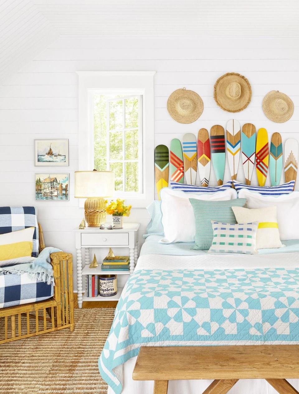 Boat Paddles and Hats Above the Bed