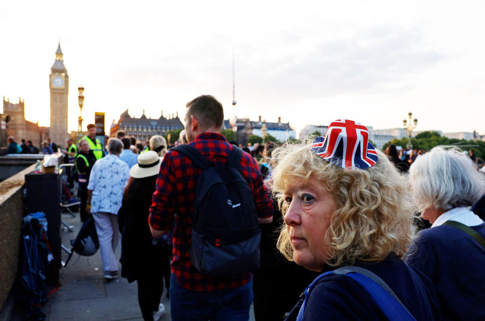 Close-up of a woman wearing a miniature Union Jack top hat