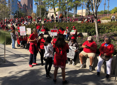 Teachers gather at Grand Park in Los Angeles for a rally after their union reached a deal with school district officials on a new proposed contract in Los Angeles, California, U.S., January 22, 2019. REUTERS/Alex Dobuzinskis