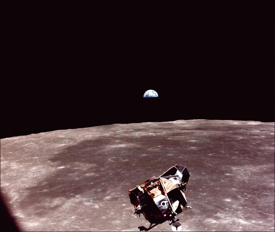 The Lunar Module (LM) of the Apollo XI space mission, with US astronauts Neil Armstrong and Edwin Aldrin aboard, is seen in lunar orbit after its liftoff from the Moon's surface on July 21, 1969 in space as it approaches the Apollo 11 command "Columbia" module for a rendez-vous. The large, dark-colored area in the background is Smith's Sea and earth rises above the lunar horizon.  (Photo: NASA/AFP/Getty Images)