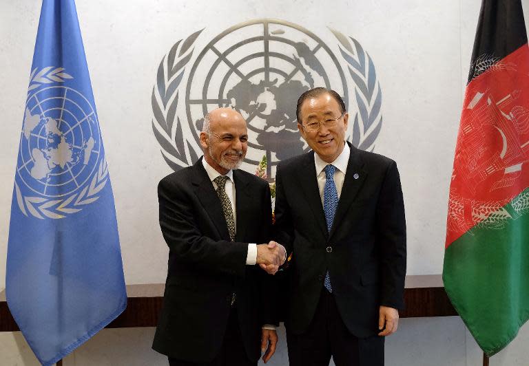 UN Secretary General Ban Ki-moon (R) greets Afghan President Ashraf Ghani before a meeting at the UN headquarters in New York, on March 26, 2015