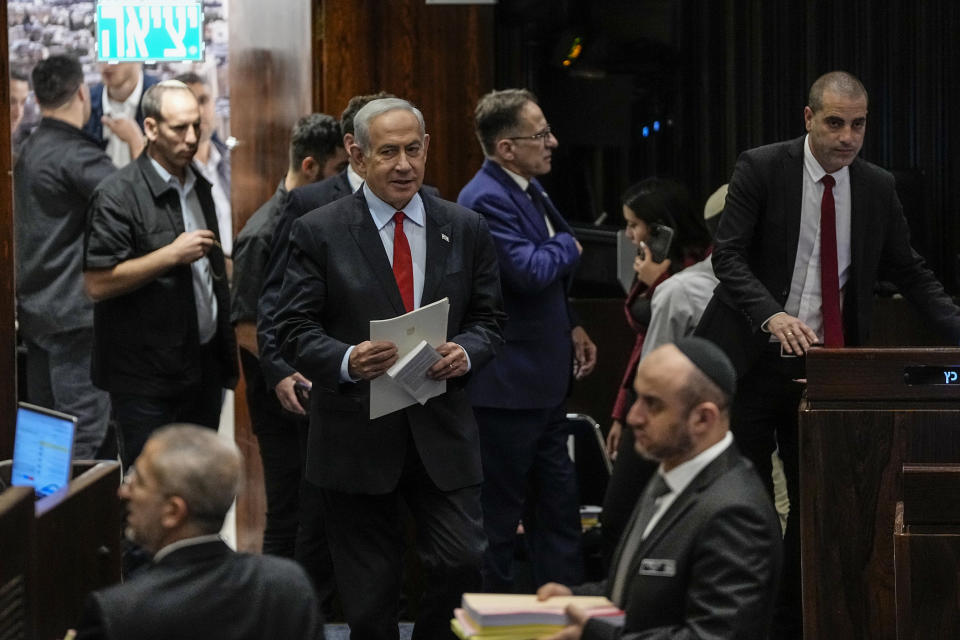 Israeli Prime Minister Benjamin Netanyahu enters the Knesset, Israel's parliament in Jerusalem, Tuesday, May 23, 2023. (AP Photo/Ohad Zwigenberg)