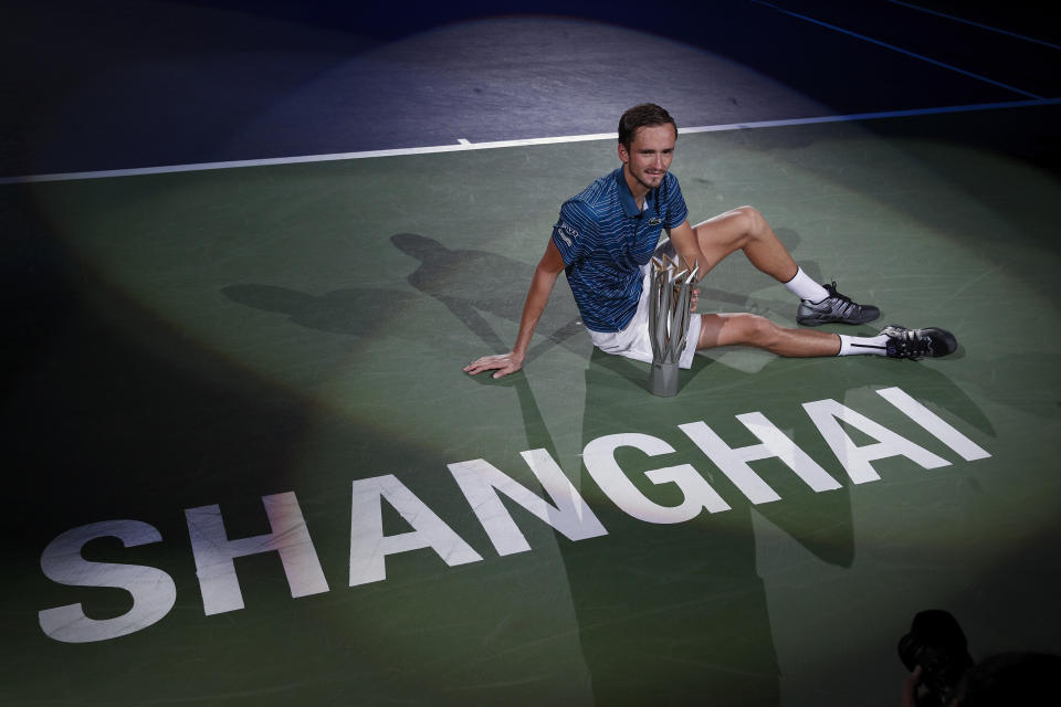 In this Sunday, Oct. 13, 2019, file photo, Daniil Medvedev of Russia poses with his winner's trophy on the court after defeating Alexander Zverev of Germany in the men's final at the Shanghai Masters tennis tournament at Qizhong Forest Sports City Tennis Center in Shanghai, China. (AP Photo/Andy Wong, File)