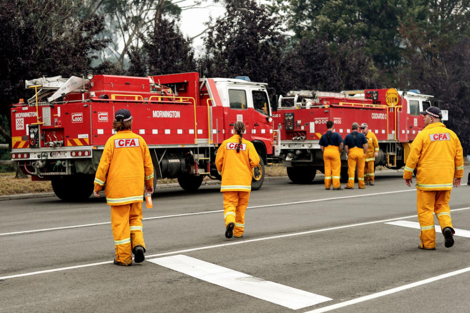 CANN RIVER AUSTRALIA - JANUARY 06: Strike team firefighters prepare to roll out on January 06, 2020 in Cann River, Australia. Milder weather conditions have provided some relief for firefighters in Victoria as bushfires continue to burn across the East Gippsland area, as clean up operation and evacuations continue. Two people have been confirmed dead and four remain missing. More than 923,000 hectares have been burnt across Victoria, with hundreds of homes and properties destroyed. 14 people have died in the fires in NSW, Victoria and South Australia since New Year's Eve. (Photo by Darrian Traynor/Getty Images)