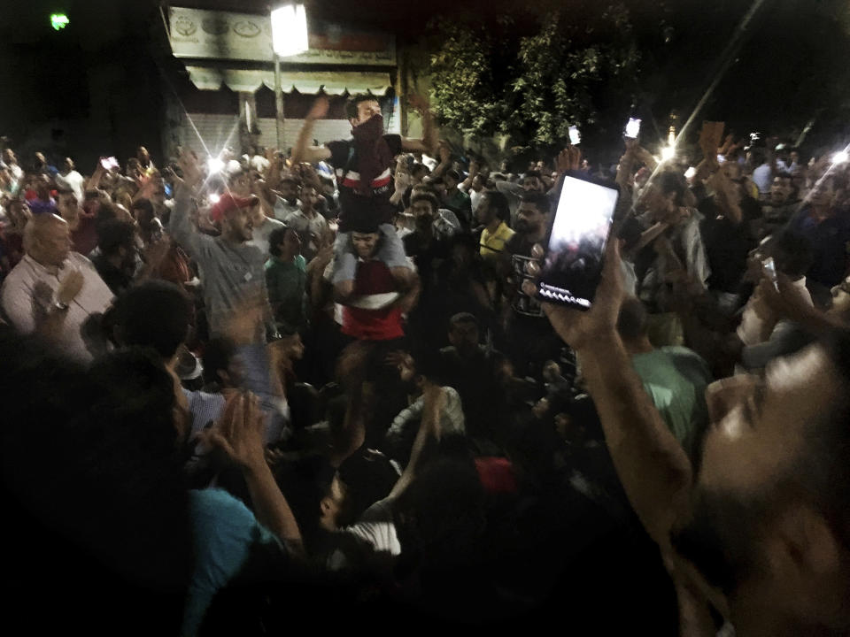 Protesters chant slogans against the regime in Cairo, Egypt, early Saturday, Sept. 21, 2019. Dozens of people held a rare protest in Cairo during which they called on Egyptian President Abdel-Fattah el-Sissi to quit. Security forces dispersed the protesters and no casualties were reported. (AP Photo/Nariman El-Mofty)