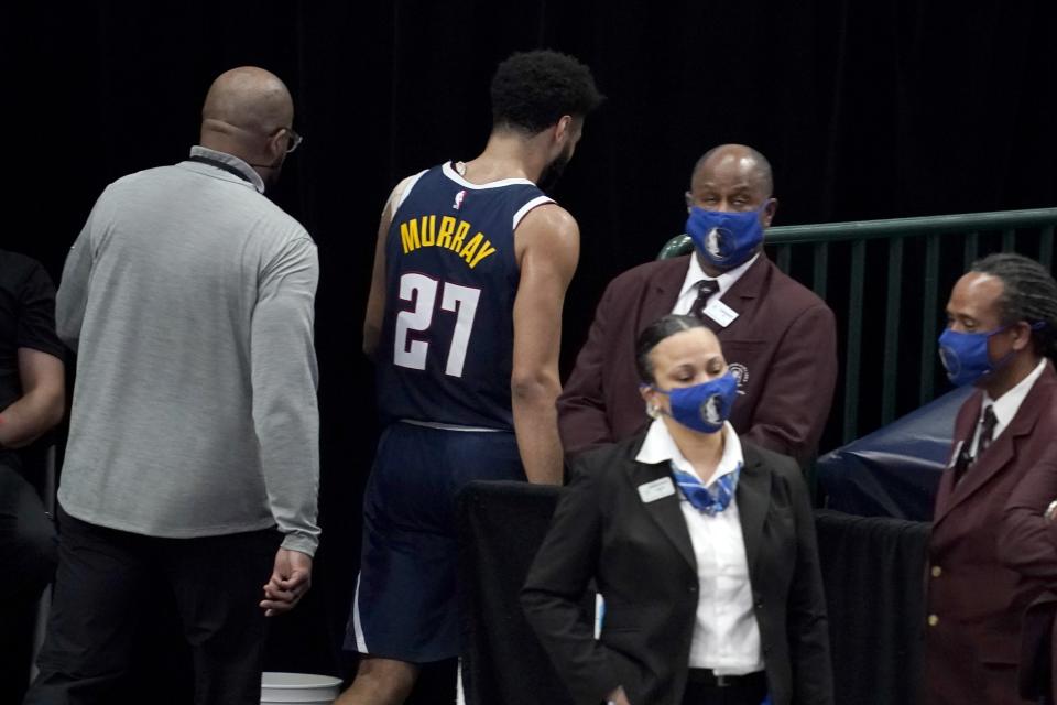 Denver Nuggets guard Jamal Murray (27) leaves the court after being ejected in the second half of an NBA basketball game against the Dallas Mavericks in Dallas, Monday, Jan. 25, 2021. (AP Photo/Tony Gutierrez)