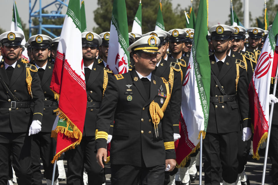 Iranian navy members march during Army Day parade in front of the mausoleum of the late revolutionary founder Ayatollah Khomeini just outside Tehran, Iran, Tuesday, April 18, 2023. Iran's President Ebrahim Raisi on Tuesday reiterated threats against Israel while marking the country's annual Army Day, though he stayed away from criticizing Saudi Arabia as Tehran seeks a détente with the kingdom. (AP Photo/Vahid Salemi)