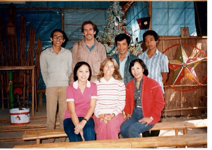 Tam, left, the day the writer (to the right) met him in the refugee camp in Thailand.