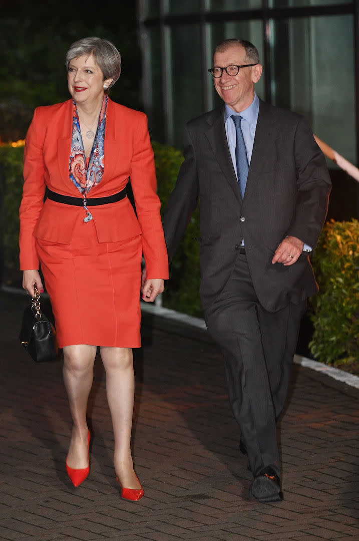 Theresa May surprised the fashion crowd in a bold red ensemble for a trip to Maidenhead [Photo: Getty] 