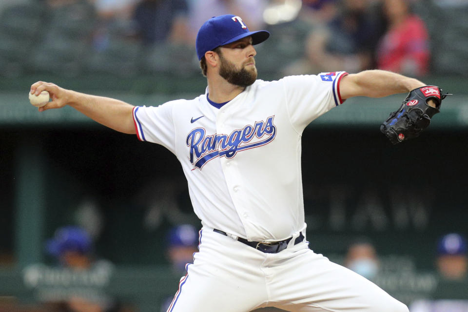 Texas Rangers starting pitcher Jordan Lyles delivers a pitch in the first inning against the Los Angeles Angels during a baseball game on Monday, April 26, 2021, in Arlington, Texas. (AP Photo/Richard W. Rodriguez)