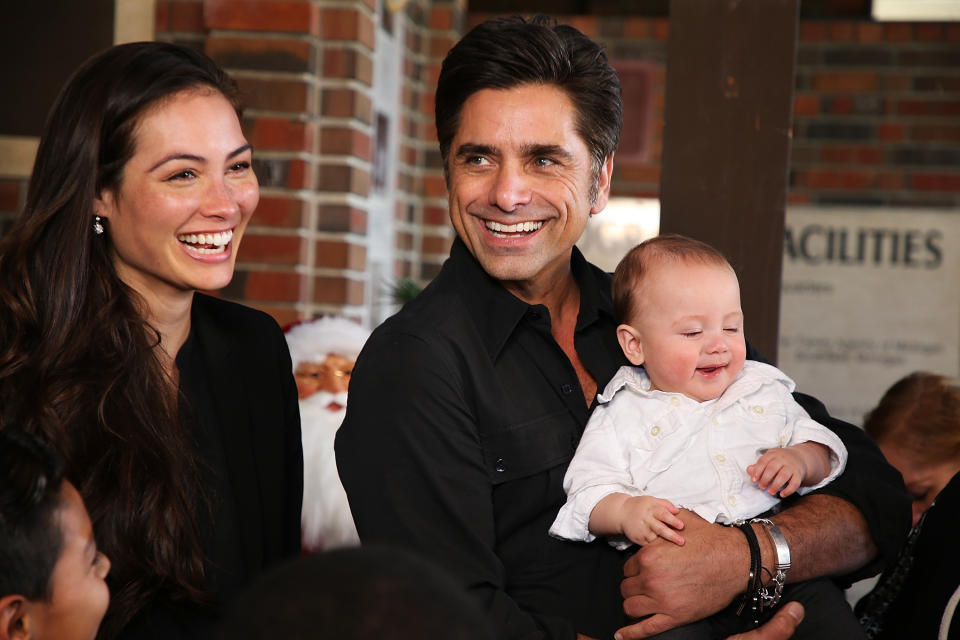 John Stamos, depicted with his wife Caitlin McHugh and their son Billy, was exposed to COVID-19 for the third time. (Photo: Phillip Faraone/Getty Images)