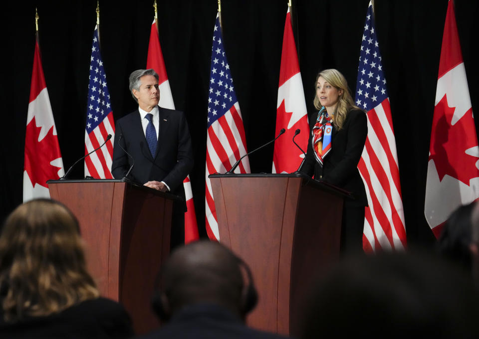 Secretary of State Antony Blinken, left, listens, as Canadian Minister of Foreign Affairs Melanie Joly speaks during a joint press conference following bilateral talks in Ottawa, Thursday, Oct. 27, 2022. (Sean Kilpatrick/The Canadian Press via AP)