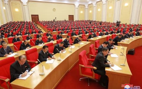 Attendees at the Third Plenary Meeting of the Seventh Central Committee of the Workers' Party of Korea  - Credit: Reuters