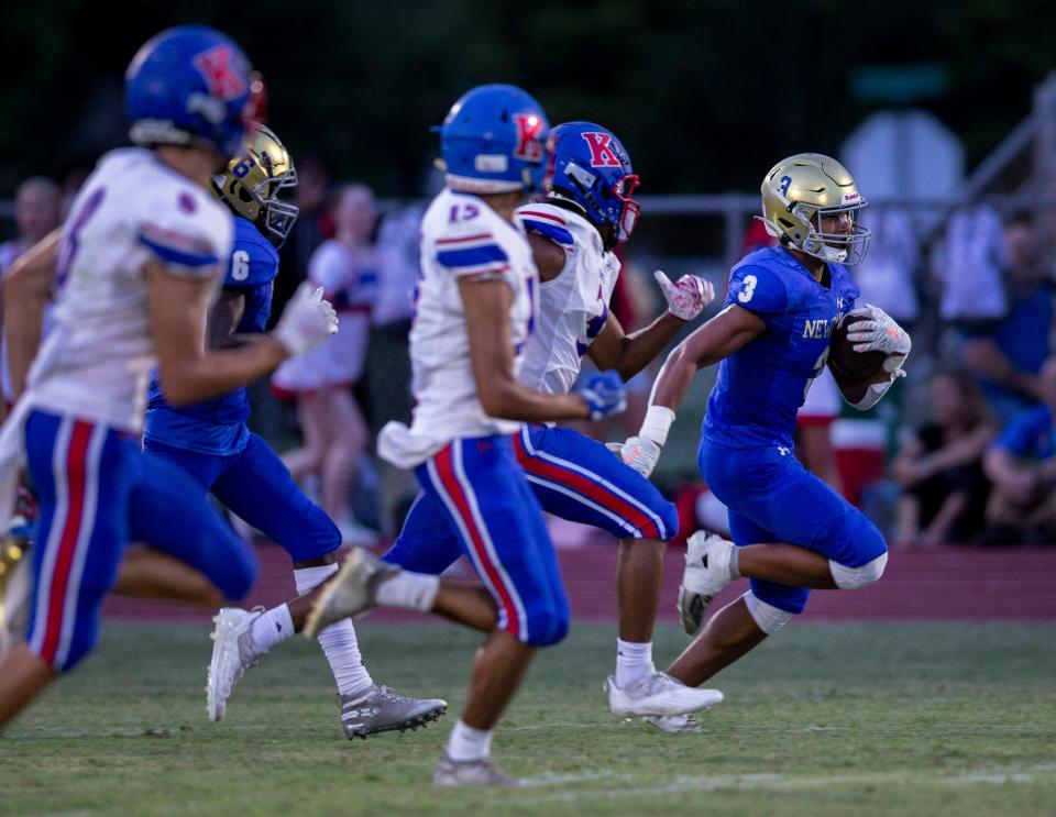 Cardinal Newman's Tovani Mizell outruns King's Academy players during their game in West Palm Beach, Florida on August 27, 2021.