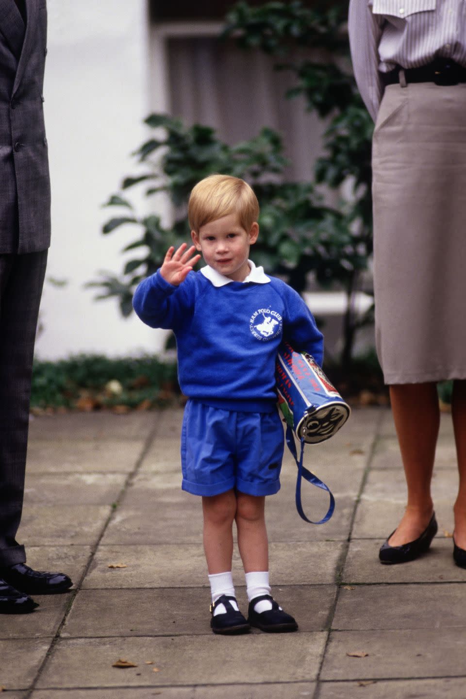 <p>Harry waves to photographers while arriving for his first day of nursery school in Notting Hill. </p>