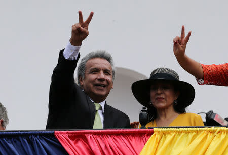 Ecuador's Presidential candidate Lenin Moreno (L) stands next to his wife Rocio Gonzalez as he greets supporters from the government palace's balcony during a military change of guard ceremony in Quito, Ecuador April 3, 2017. REUTERS/Mariana Bazo