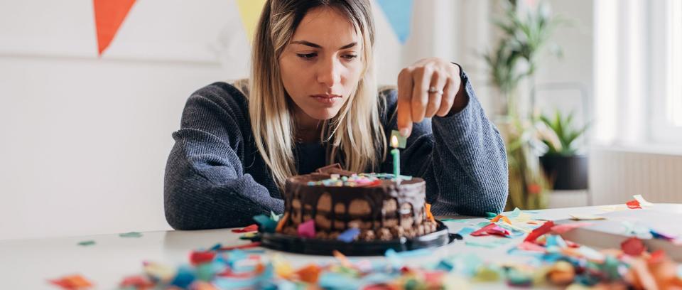 Sad woman celebrating birthday alone