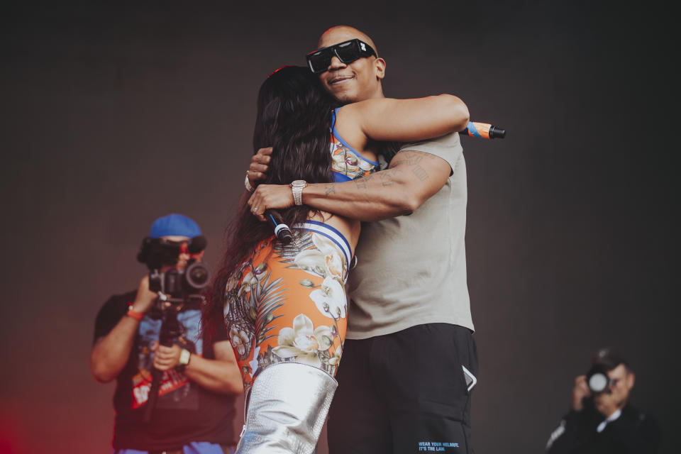 Ashanti and Ja Rule embrace during their performance on the opening day of Dreamville Festival. - Credit: BRANDON TODD / THE PARALLEL AGENCY