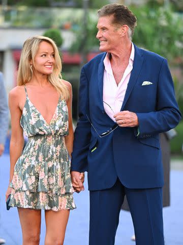 <p>Stephane Cardinale - Corbis/Corbis/Getty</p> David Hasselhoff and Hayley Roberts during the 61st Monte Carlo TV Festival in 2022.