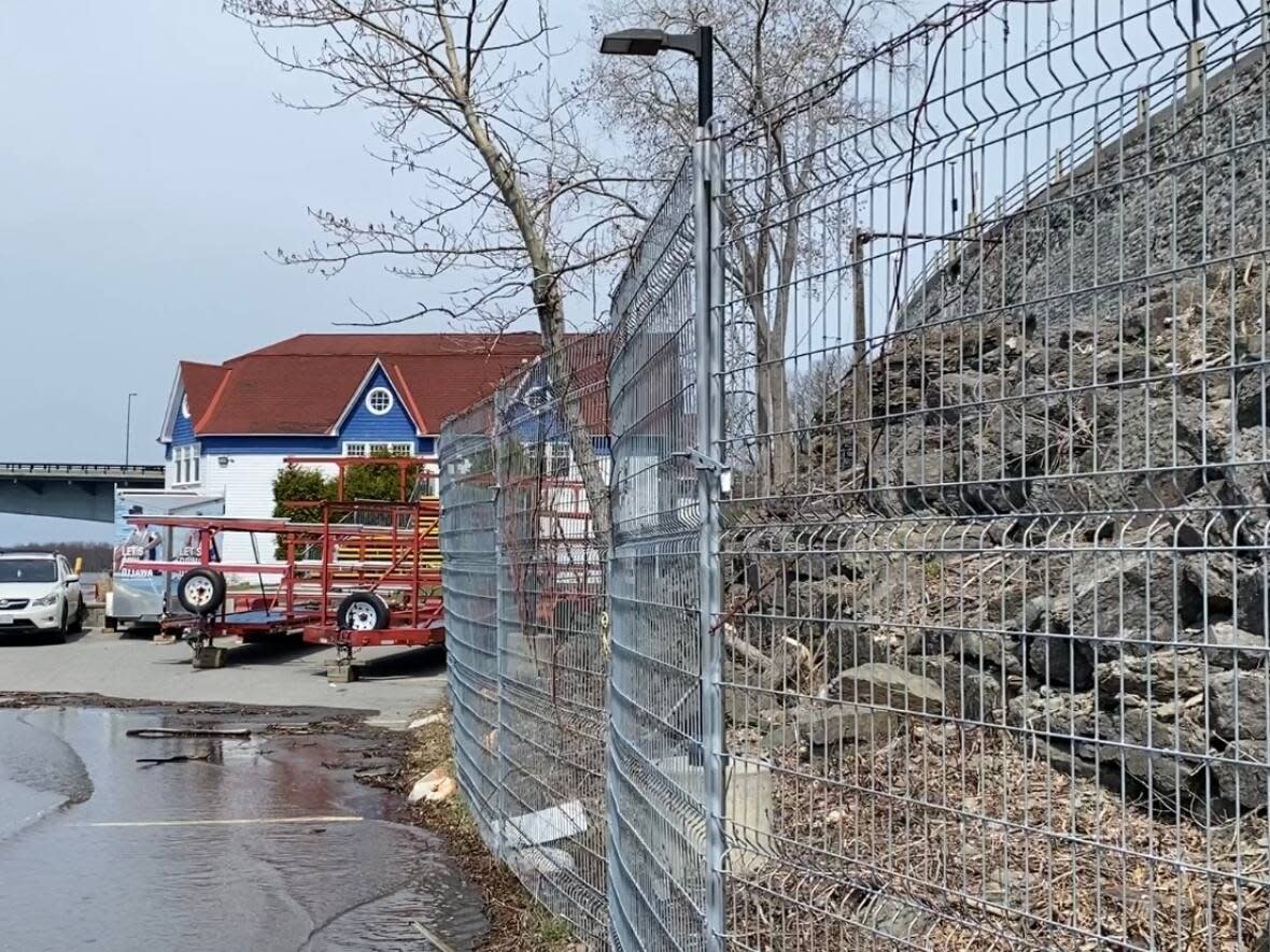 The Ottawa Rowing Club sits along the Ottawa River below Lady Grey Drive. The National Capital Commission is building a new retaining wall to replace the current one seen at right, which is more than 110 years old. (Kimberley Molina/CBC - image credit)