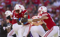 Nebraska quarterback Heinrich Haarberg, right, hands off the ball to Emmett Johnson, left, against Northwestern during the first half of an NCAA college football game Saturday, Oct. 21, 2023, in Lincoln, Neb. (AP Photo/Rebecca S. Gratz)
