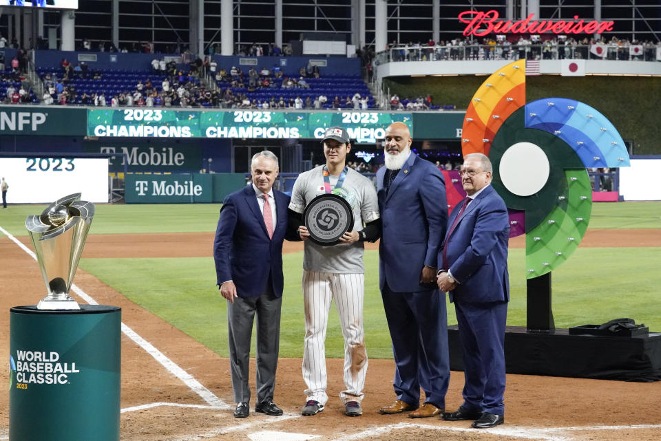 Japan's Shohei Ohtani (16) receives the MVP Award after defeating the United States in World Baseball Classic championship game, Tuesday, March 21, 2023, in Miami. (AP Photo/Wilfredo Lee)