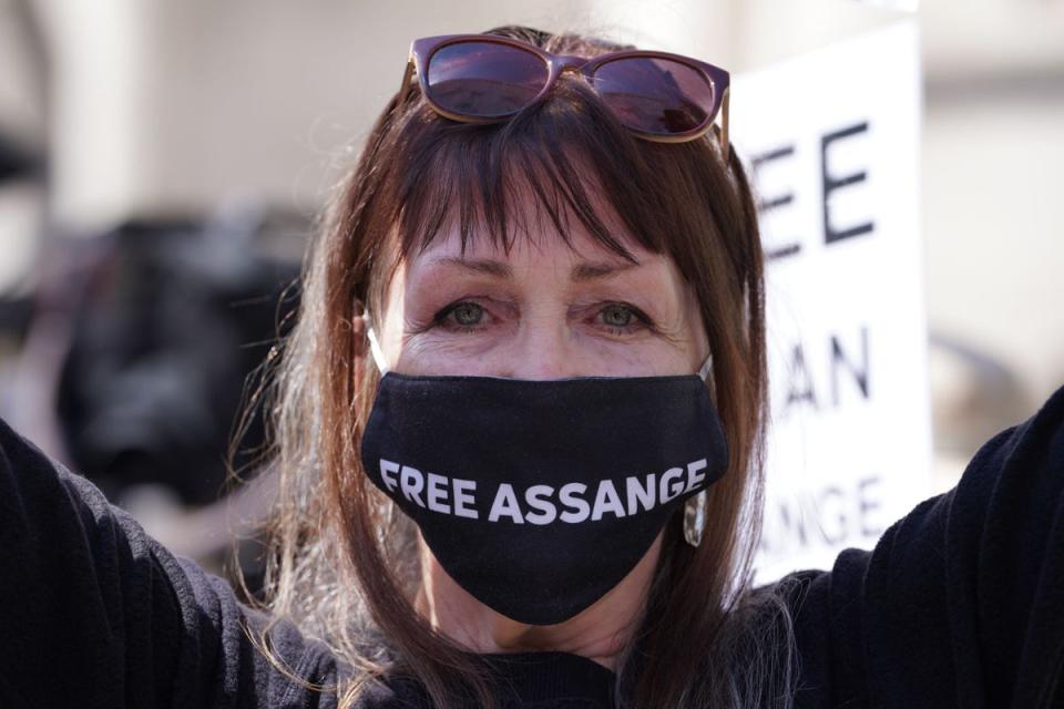 A supporter of Julian Assange outside the Royal Courts of Justice in London (Lucy North/PA Wire)